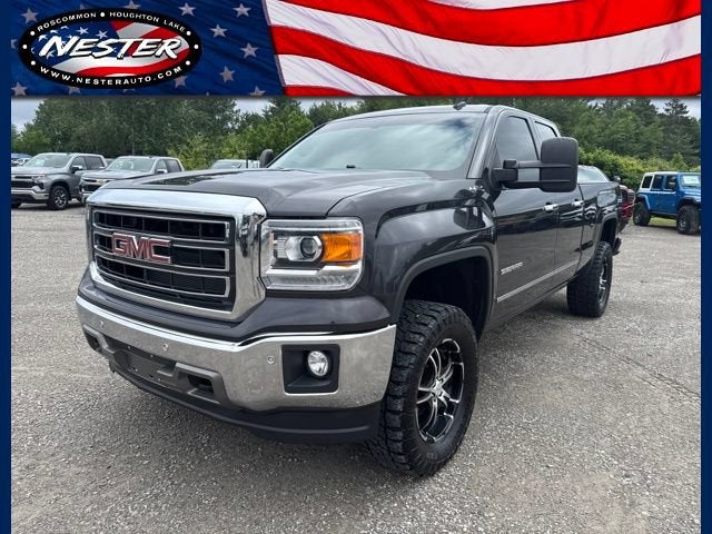2014 GMC Sierra 1500 SLT in Iridium Metallic — front three-quarter view