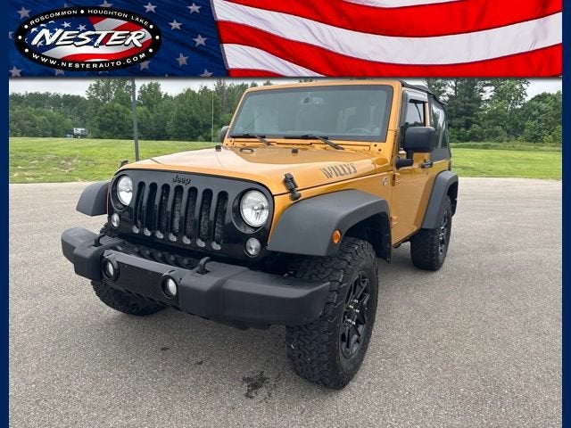 2014 Jeep Wrangler Sport in Gold — front three-quarter view